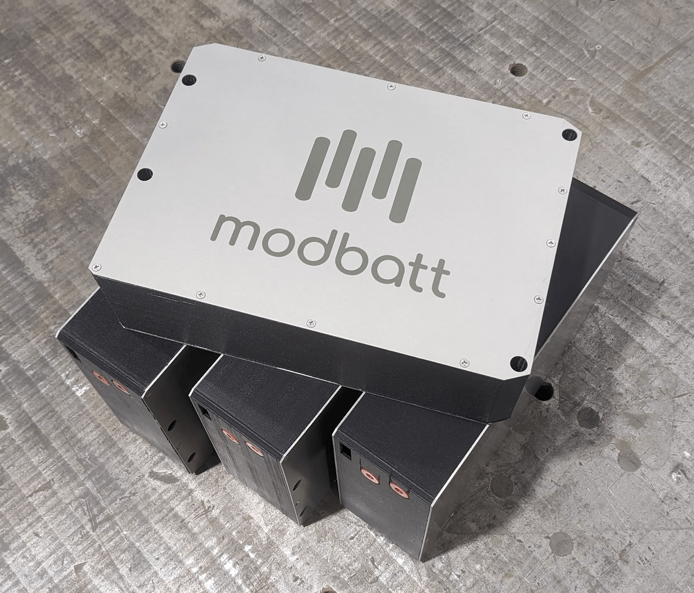 Four Modbatt modules; one sitting on top of the other three.